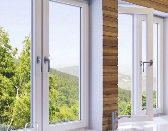 Ein offenes weißes Kunststofffenster von REHAU mit Blick ins Grüne
